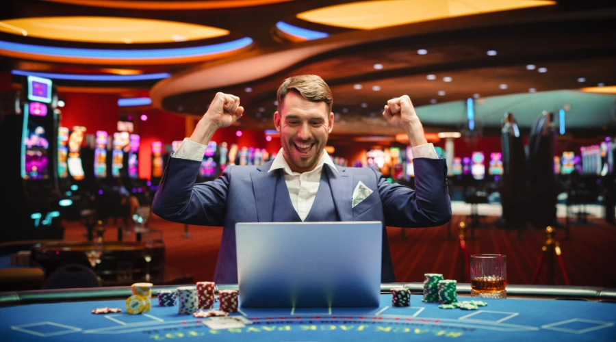 Image of a man celebrating and cheering his win at casino