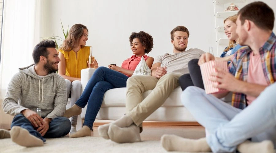 Image of couples group therapy - Supportive friends relaxing together during trauma recovery journey