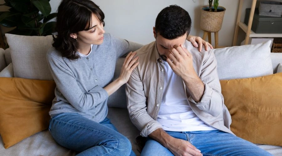 Woman supporting partner through emotional trauma recovery