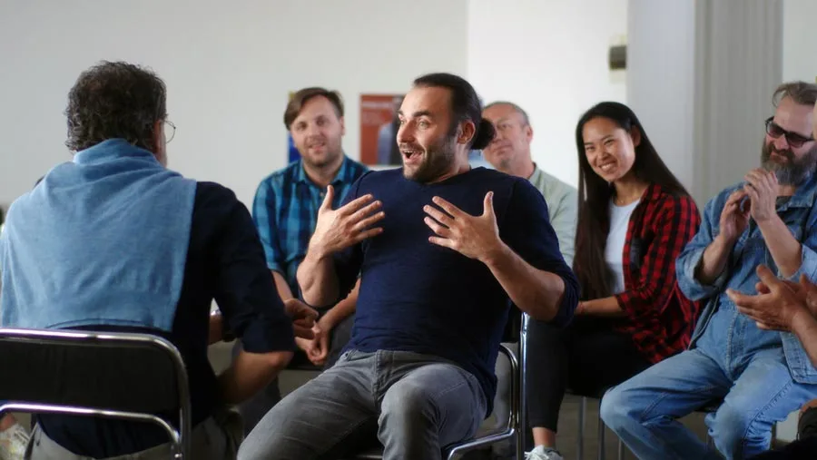 Man talking about his dreams at an AA support group meeting