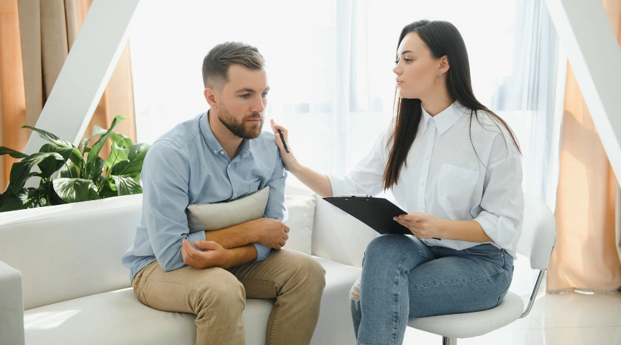 Image of therapist supporting a patient during a professional addiction treatment session