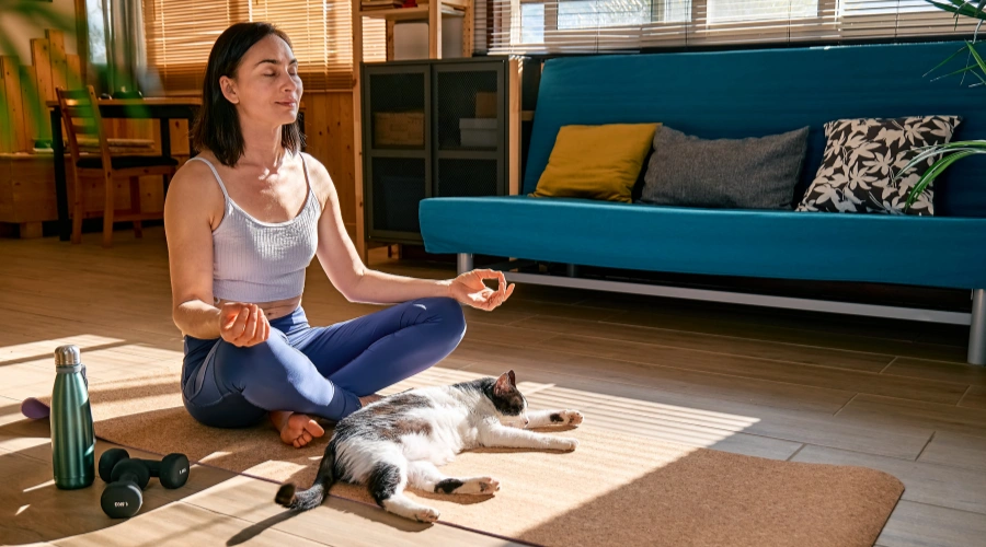 Image of woman practicing yoga as part of lifestyle changes for stable mental health and PTSD recovery