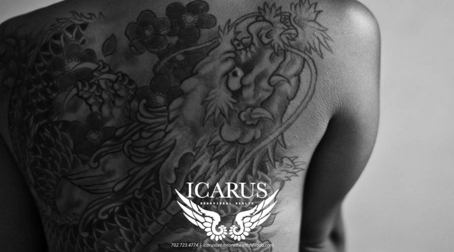 Image of Powerful Dragon Gate tattoo on a person's back - Mental Health Awareness Tattoos