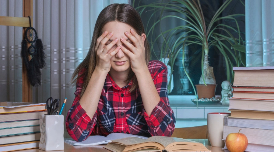 Image of a Person struggling with procrastination due to childhood trauma