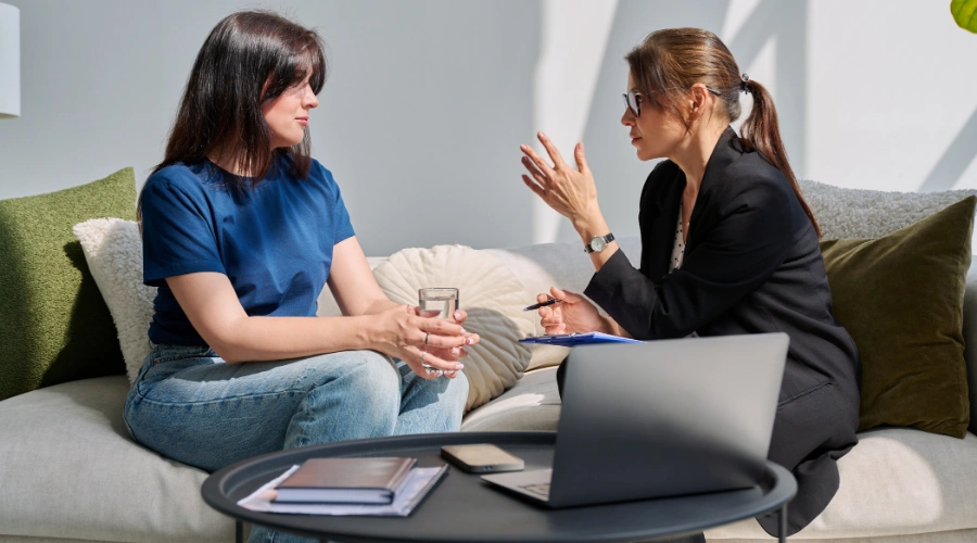 Image of a person setting personal boundaries and calmly asserting limits in a conversation
