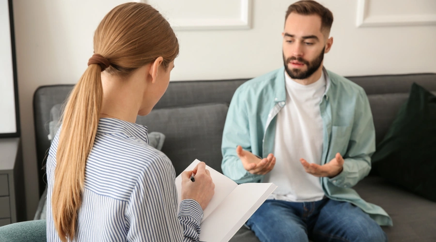 Image of a caring counselor supporting a patient during recovery
