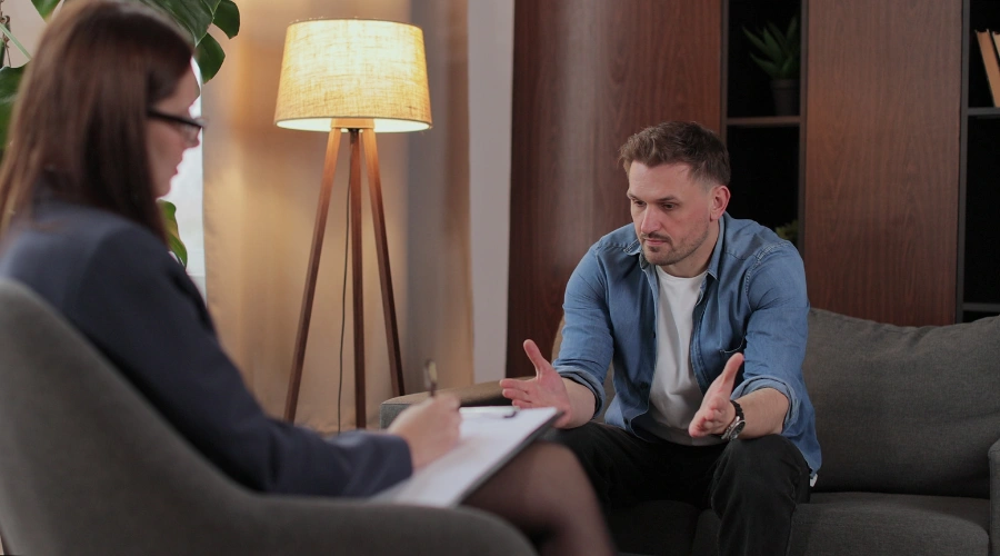 Image of a man in therapy with his addiction treatment counselor