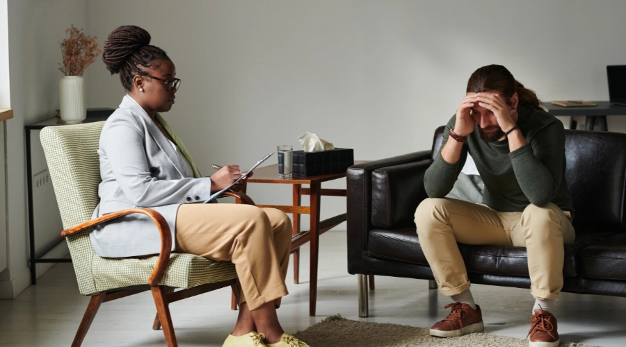 Image of a Probation officer reviewing drug test results and meeting with a man on probation after his first failed drug test