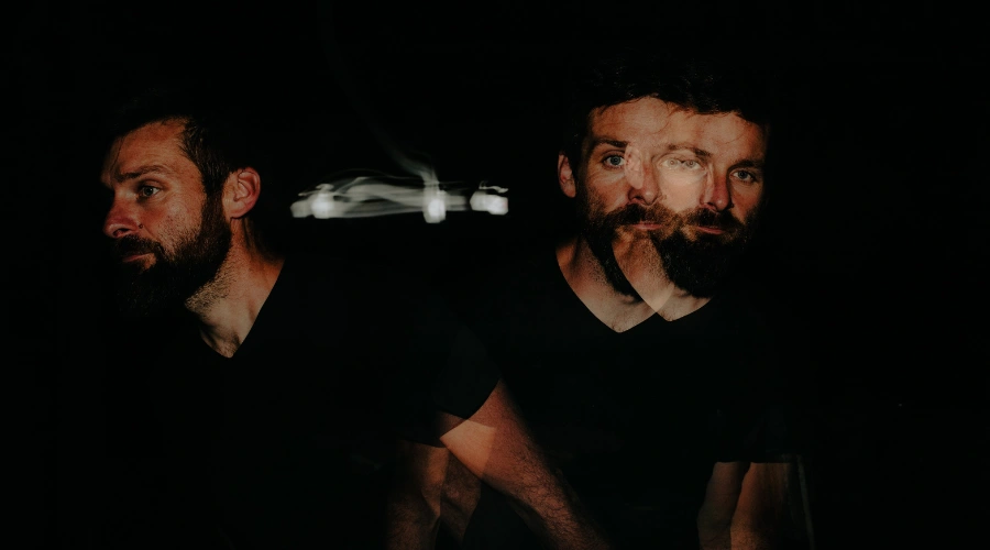 Image of a conceptual split portrait representing the difference between hallucinations as false sensory